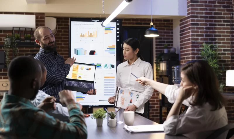 professionals-present-financial-charts-meeting